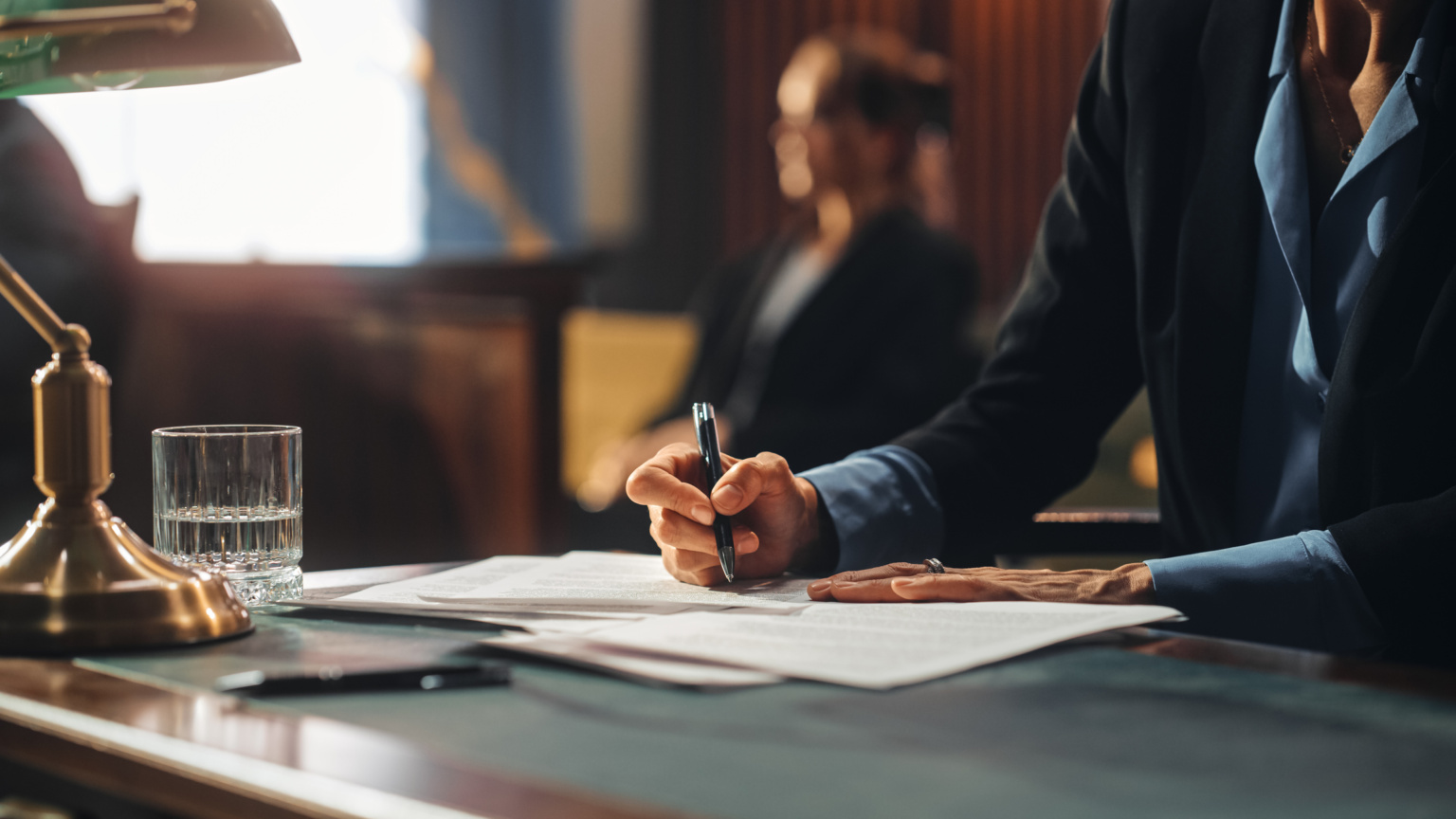 Court Of Justice And Law Trial: Female Public Defender Writes Down Arguments For Defence Strategy. Successful Attorney Lawyer Fight For Freedom Of Her Client With Supporting Evidence. Close Up.