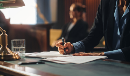 Court Of Justice And Law Trial: Female Public Defender Writes Down Arguments For Defence Strategy. Successful Attorney Lawyer Fight For Freedom Of Her Client With Supporting Evidence. Close Up.