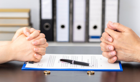 Wife And Husband Signing Divorce