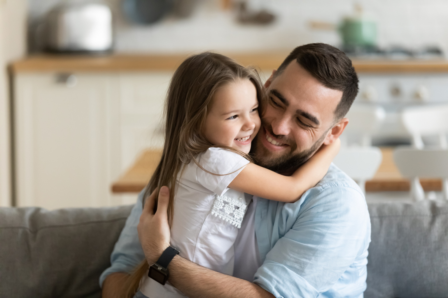 Close Up Smiling Loving Young Father Hugging Adorable Little Daughter