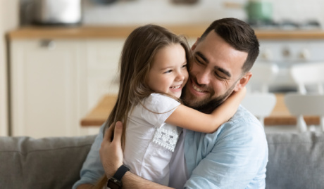 Close Up Smiling Loving Young Father Hugging Adorable Little Daughter
